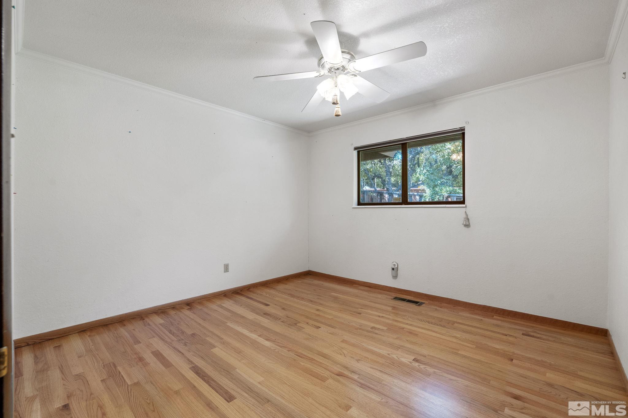 1575 Webster Way Reno, NV 89509 - Photo 29 of 40 wooden floor in an empty room with a window