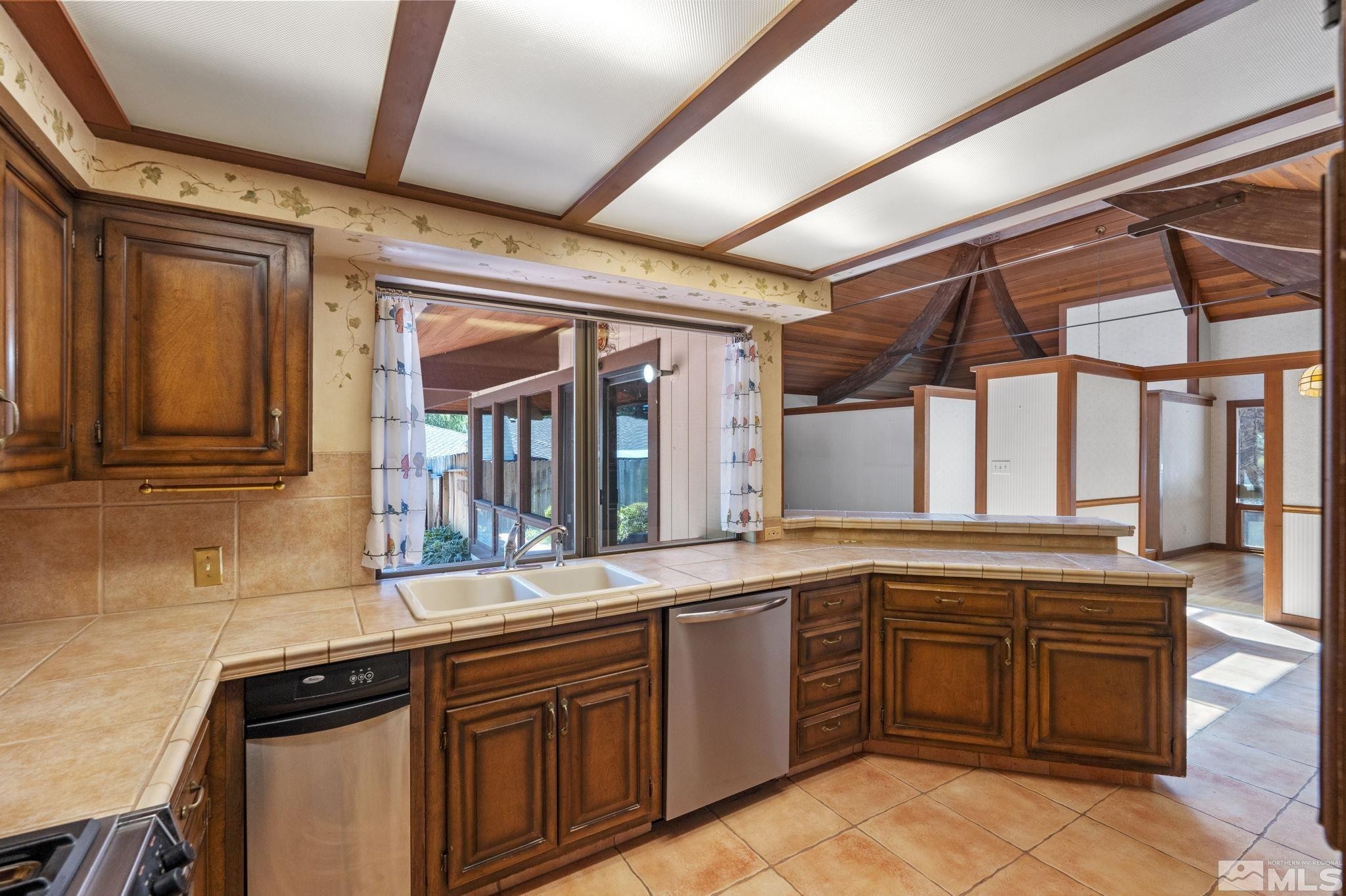 1575 Webster Way Reno, NV 89509 - Photo 3 of 40 a kitchen with a sink and cabinets