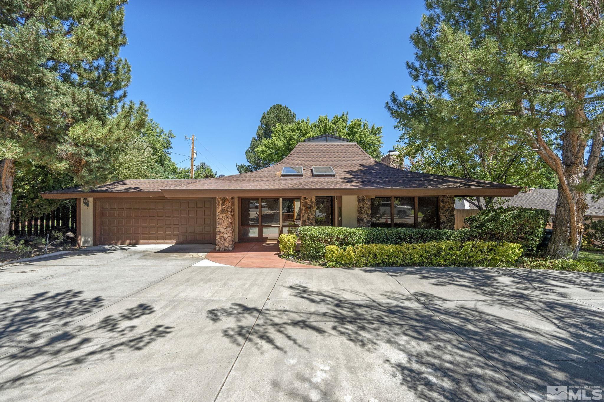 1575 Webster Way Reno, NV 89509 - Photo 5 of 40 a front view of a house with a yard and potted plants