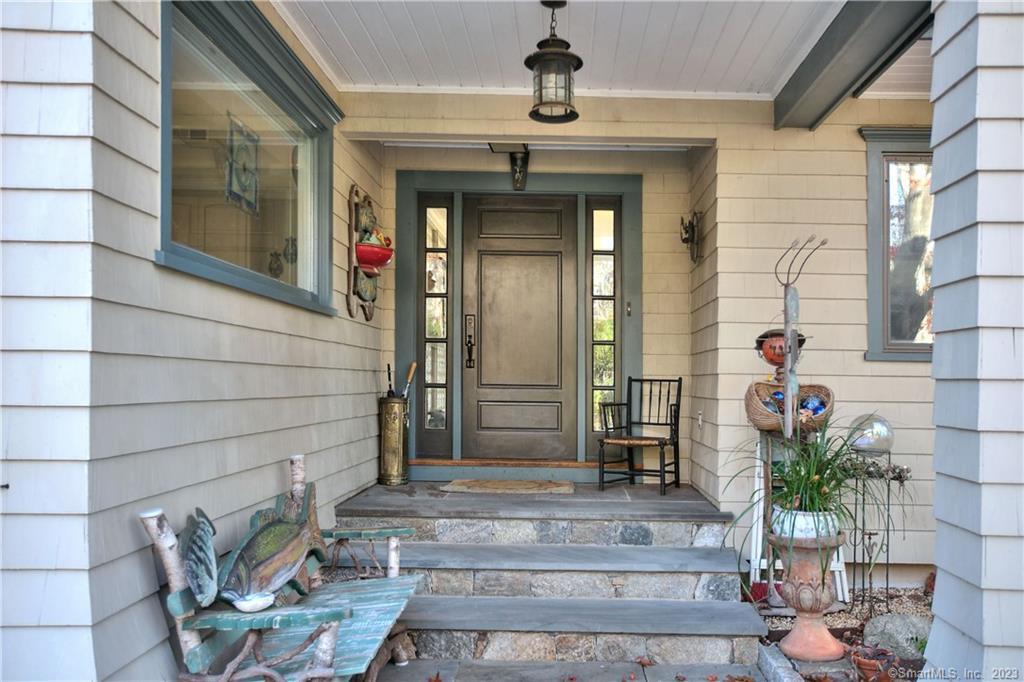 43 White Birch Road Weston, CT 06883 - Photo 1 of 1 a front view of a house with outdoor seating