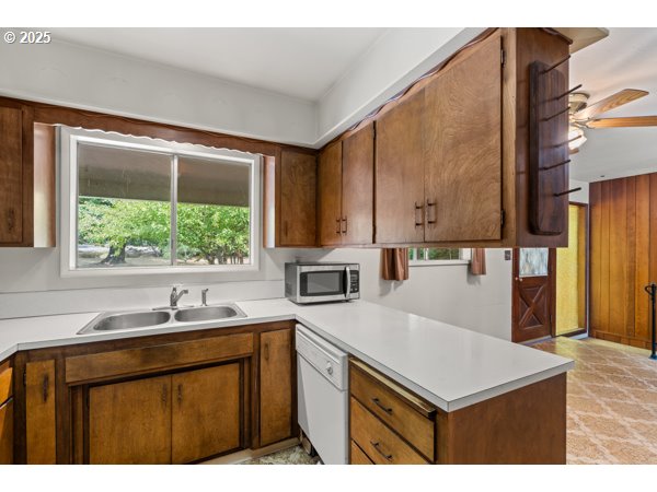 8108 Azalea-Glen Road Glendale, OR 97442 - Photo 11 of 44 a kitchen with a sink cabinets and window