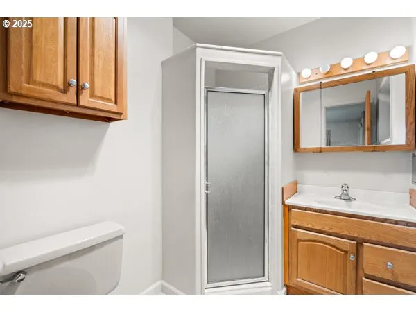a bathroom with a sink a mirror and vanity
