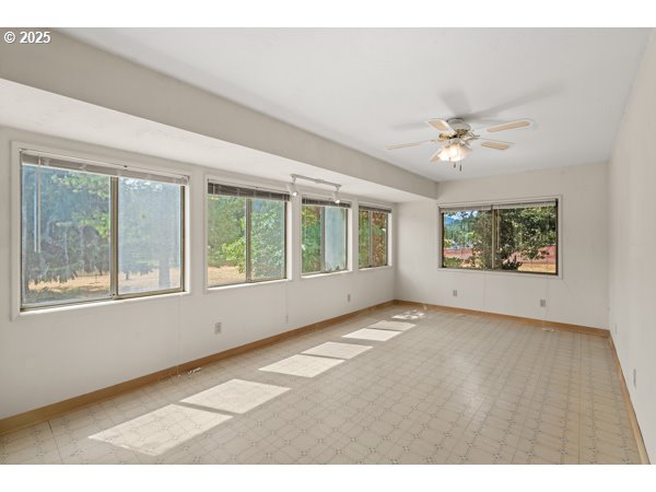 8108 Azalea-Glen Road Glendale, OR 97442 - Photo 2 of 44 a view of an empty room with a window