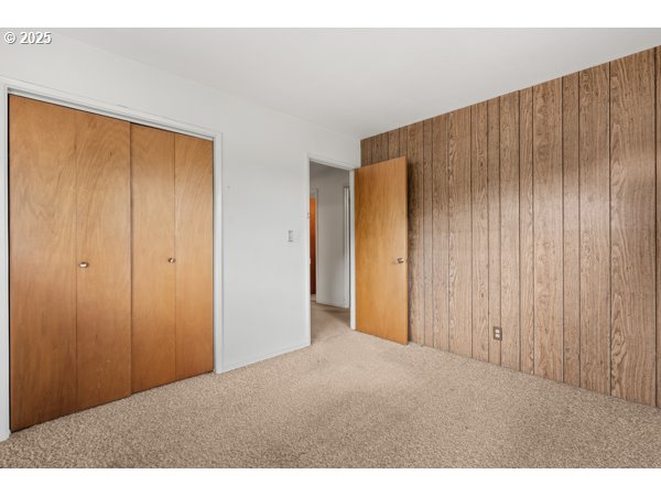 8108 Azalea-Glen Road Glendale, OR 97442 - Photo 21 of 44 a view of an empty room with wooden walls
