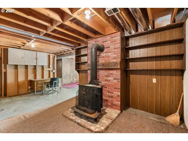 a living room with furniture a window and a fireplace