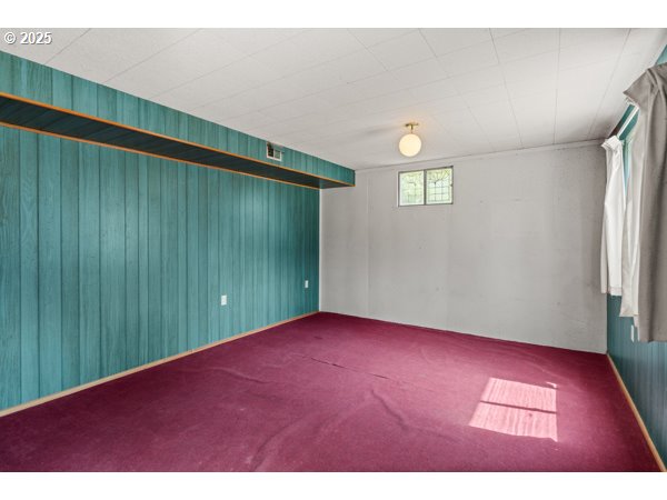 8108 Azalea-Glen Road Glendale, OR 97442 - Photo 26 of 44 a view of an empty room with wooden floor