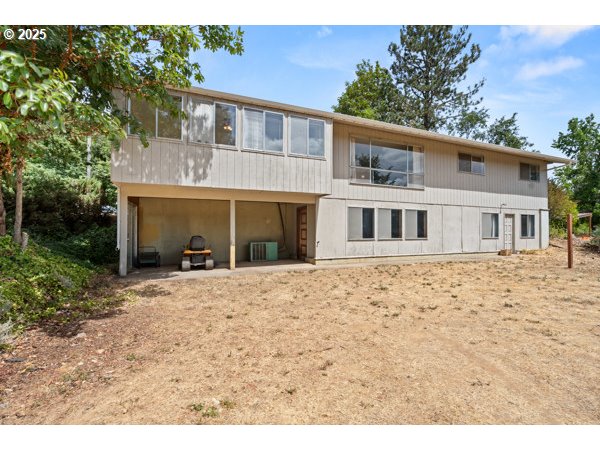 8108 Azalea-Glen Road Glendale, OR 97442 - Photo 36 of 44 a front view of a house with a garden