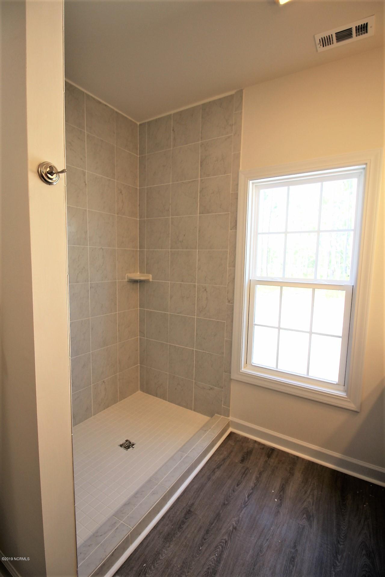 310 George Taylor Road Newport, NC 28570 - Photo 27 of 44 Large tile walk in shower