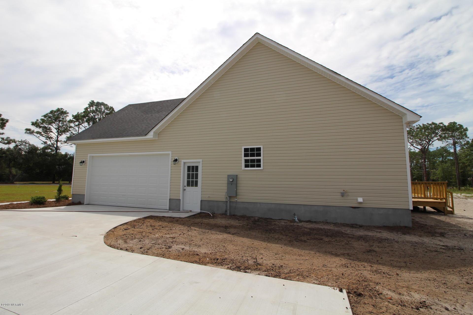 310 George Taylor Road Newport, NC 28570 - Photo 43 of 44 Right side entrance garage door