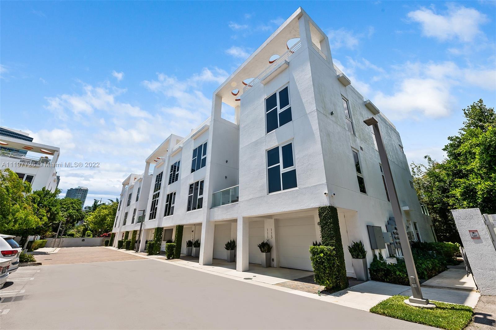 455 Northeast 39th Street, Unit 112 Miami, FL 33137 - Photo 1 of 40 a view of a building with a street