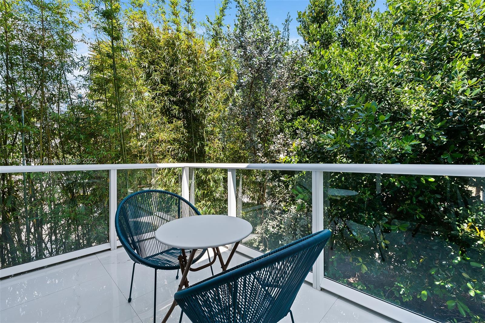 455 Northeast 39th Street, Unit 112 Miami, FL 33137 - Photo 12 of 40 a view of a two chairs in the deck