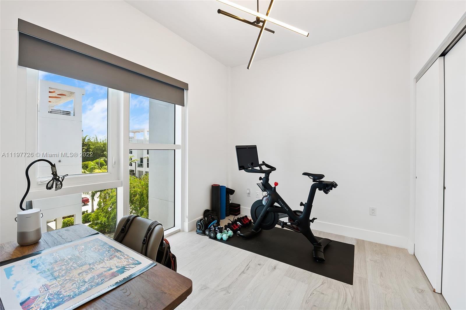 455 Northeast 39th Street, Unit 112 Miami, FL 33137 - Photo 22 of 40 a view of a room with gym equipment