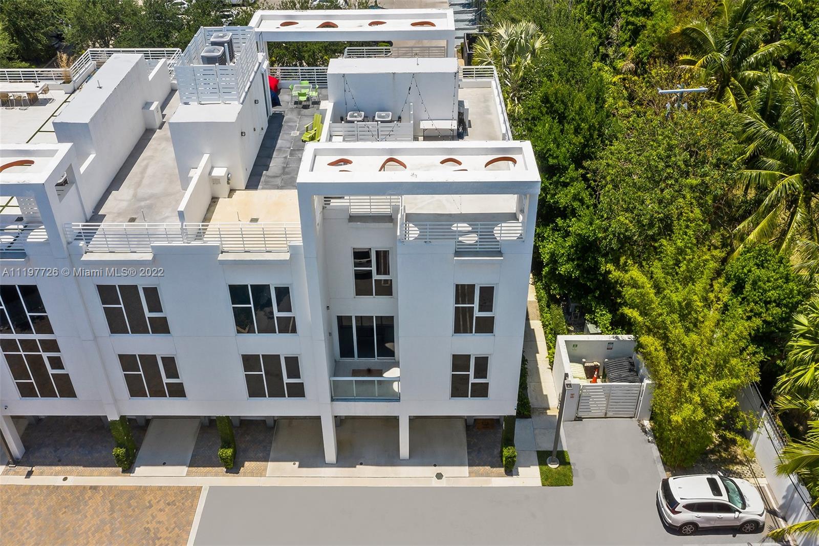 455 Northeast 39th Street, Unit 112 Miami, FL 33137 - Photo 29 of 40 a view of a white building with many windows