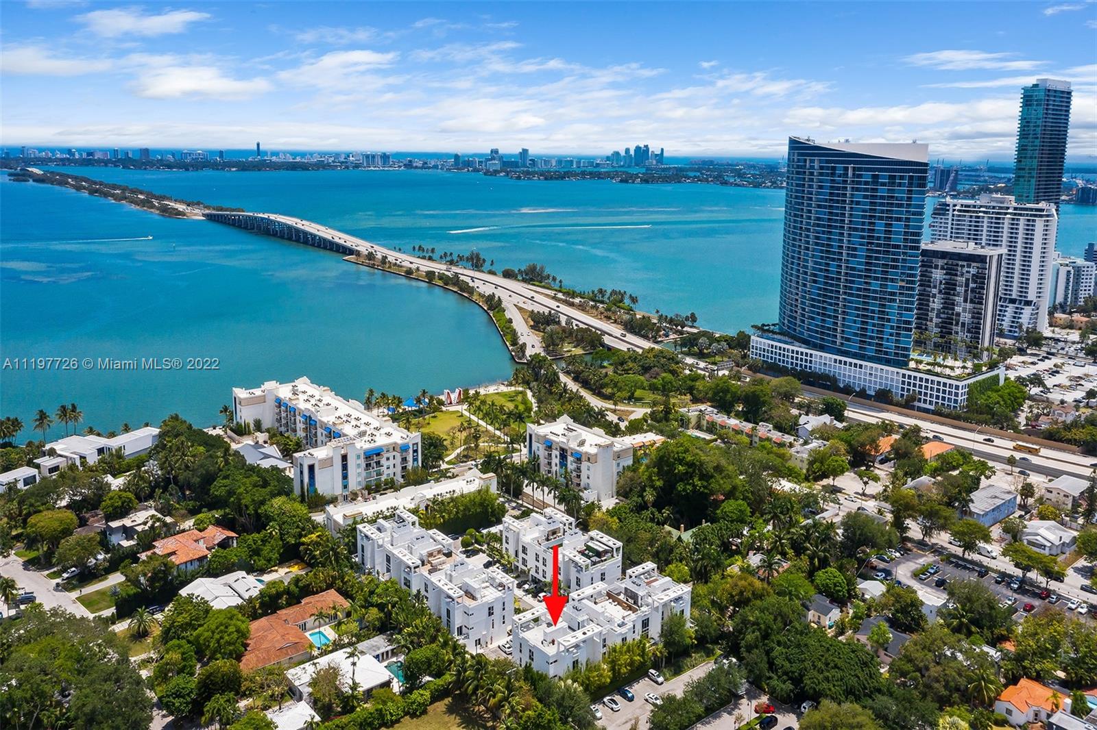 455 Northeast 39th Street, Unit 112 Miami, FL 33137 - Photo 36 of 40 a view of a lake with a city