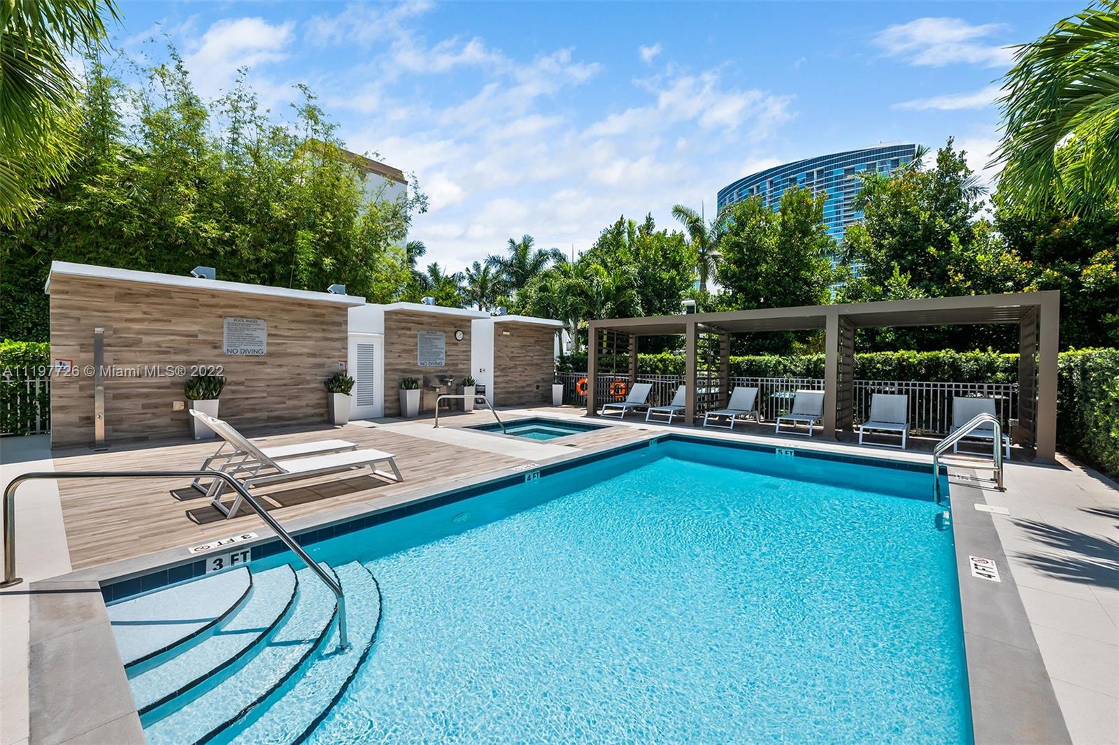 455 Northeast 39th Street, Unit 112 Miami, FL 33137 - Photo 38 of 40 a view of swimming pool with chairs