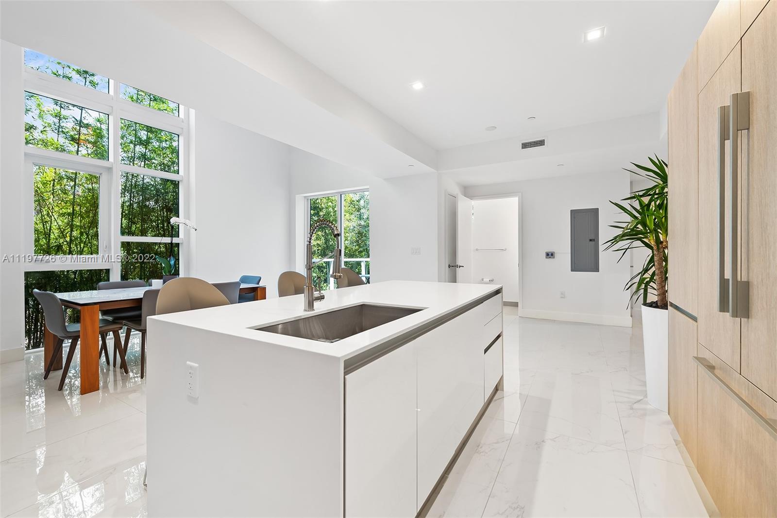 455 Northeast 39th Street, Unit 112 Miami, FL 33137 - Photo 7 of 40 a view of a kitchen with furniture and windows