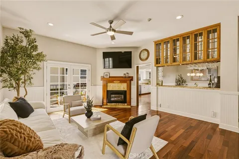 a dining room with furniture and wooden floor
