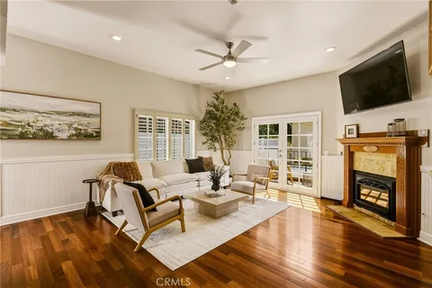 a front view of a house with wooden floor and a window