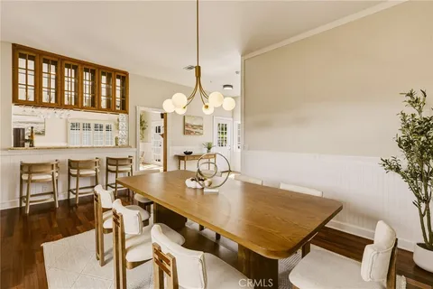 a living room with a rug and a table
