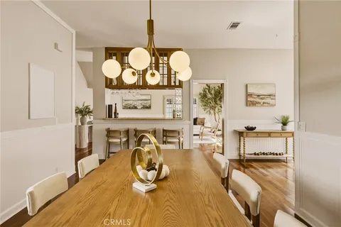 a kitchen with granite countertop white cabinets and a sink