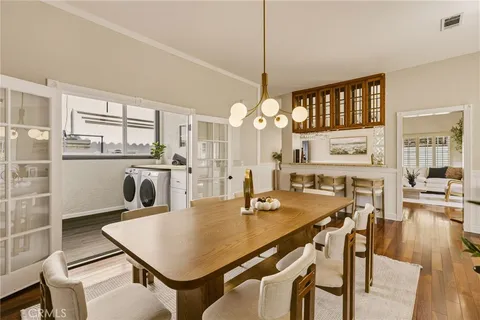 a kitchen with stainless steel appliances granite countertop a refrigerator and a stove