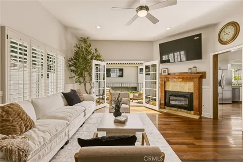 a living room with fireplace furniture and a flat screen tv