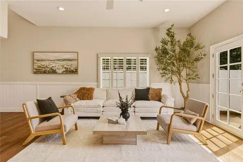 a view of a patio with couches chairs and potted plants