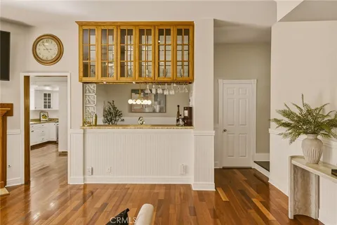 a living room with furniture wooden floor and a fireplace