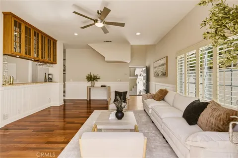 a living room with fireplace furniture and a flat screen tv