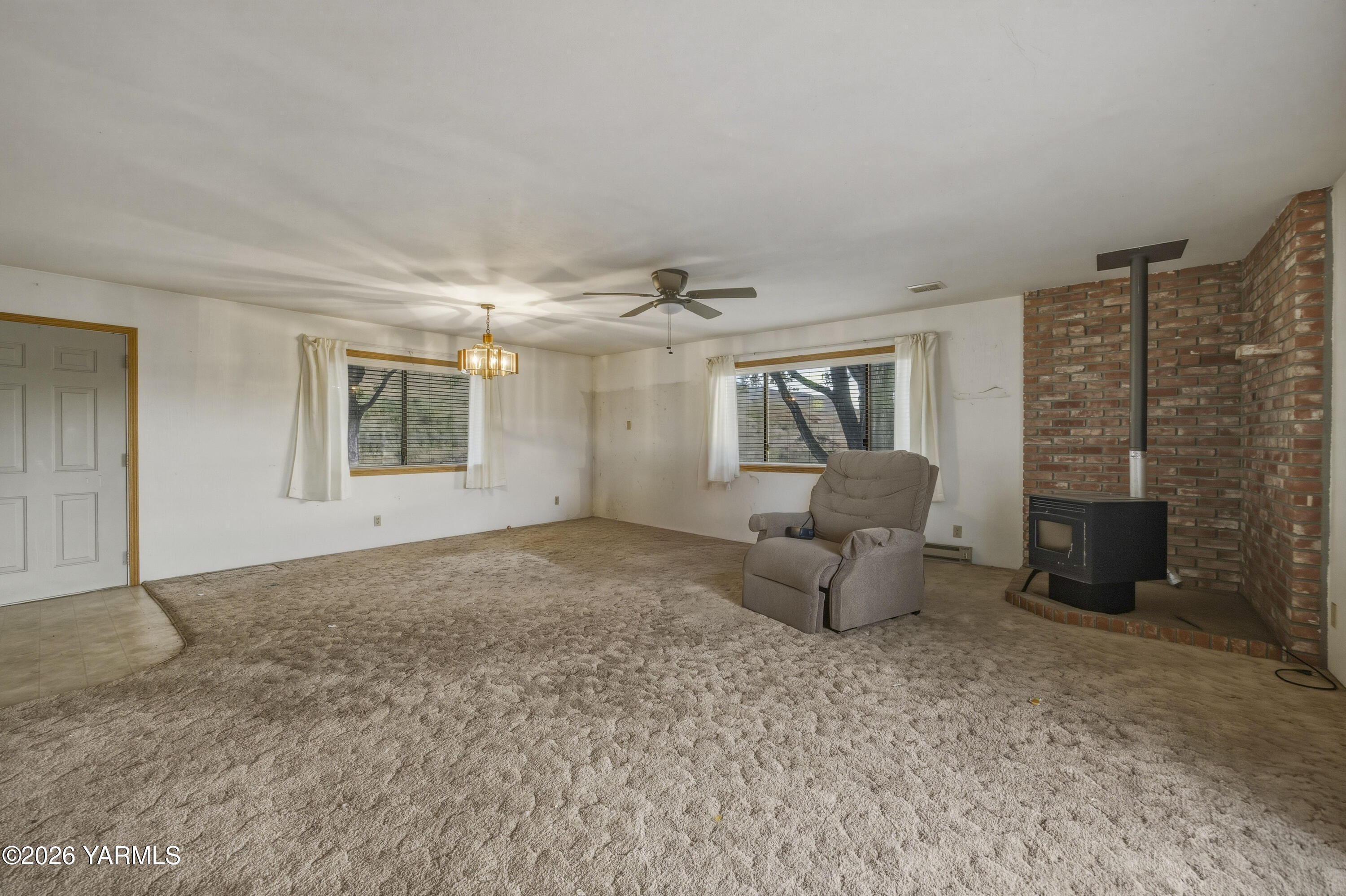 36322 D Mccall Road North Benton City, WA 99320 - Photo 27 of 39 a living room with furniture and a fireplace