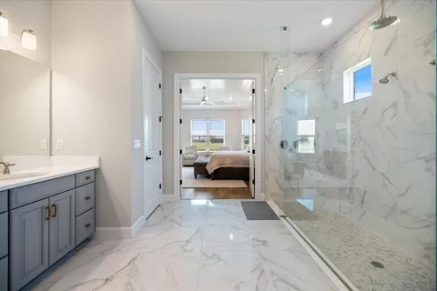 a view of a bathroom with a sink and shower