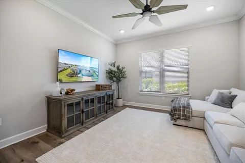 a living room with furniture and windows