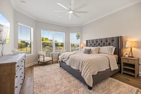 a bed room with a bed and a chair