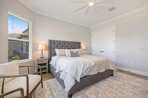 a bed room with a bed and a window