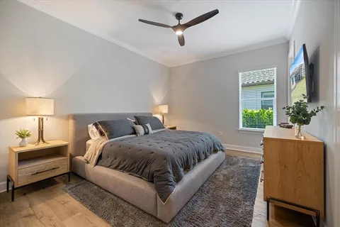 a bedroom with bed and window