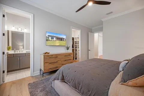 a bedroom with a bed and a dresser