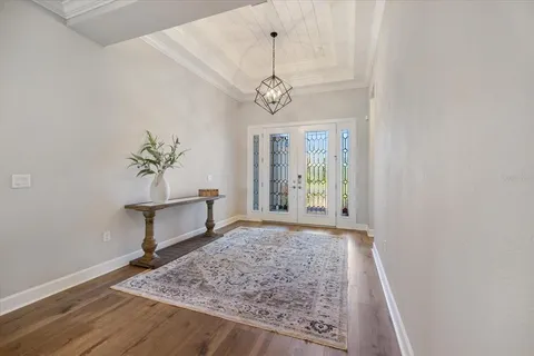 a view of an entryway with wooden floor