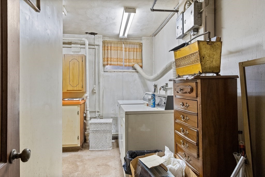 265 Varick Road Newton, MA 02468 - Photo 15 of 22 a room with cabinets and washer
