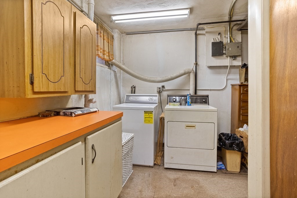 265 Varick Road Newton, MA 02468 - Photo 17 of 22 a utility room with dryer and washer