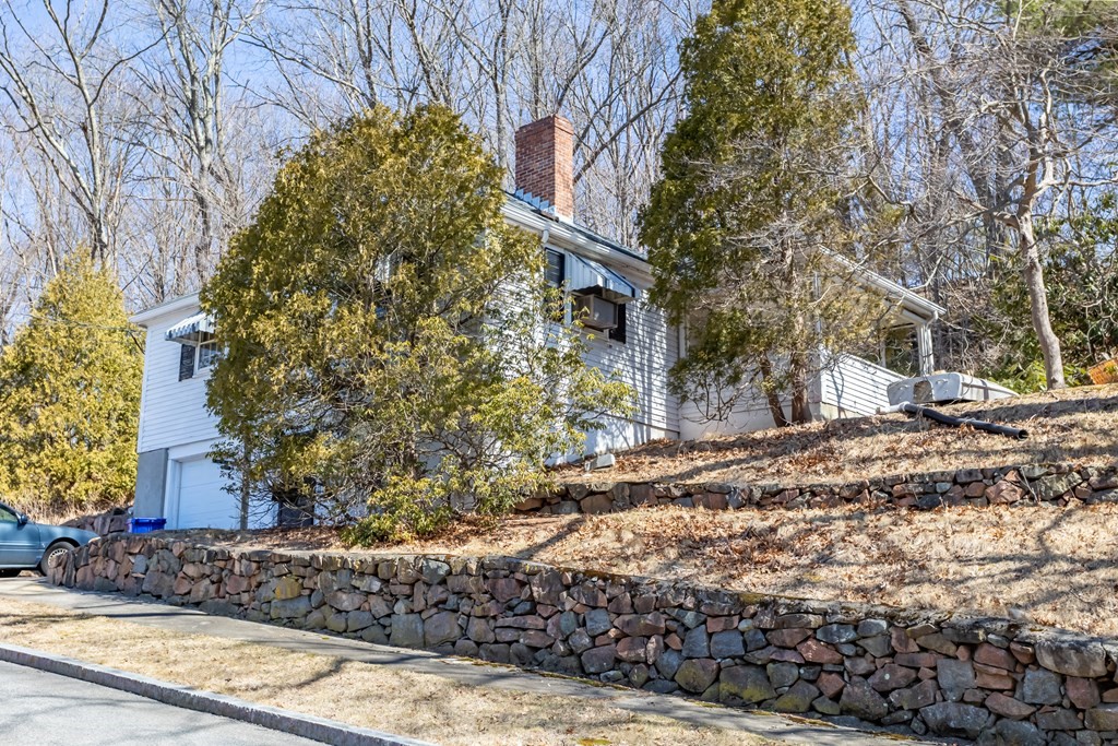 265 Varick Road Newton, MA 02468 - Photo 2 of 22 a backyard of a house with lots of green space