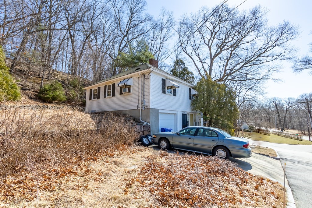 265 Varick Road Newton, MA 02468 - Photo 3 of 22 a front view of a house with cars parked on road