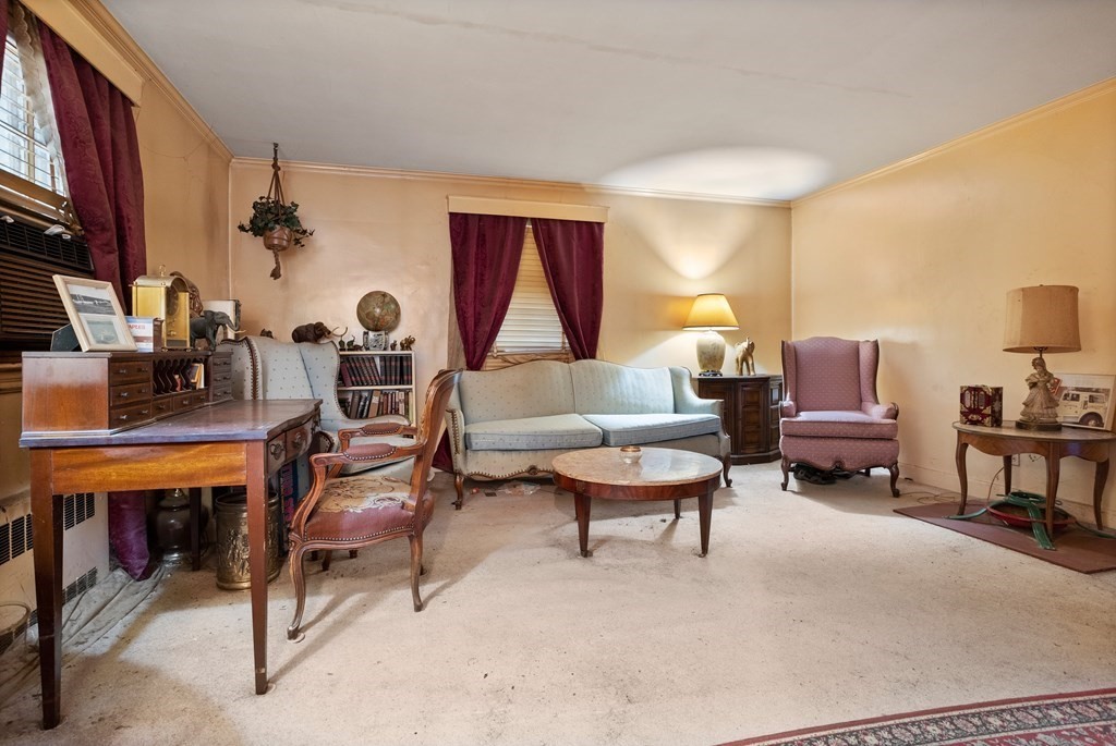 265 Varick Road Newton, MA 02468 - Photo 5 of 22 a living room with furniture and a lamp