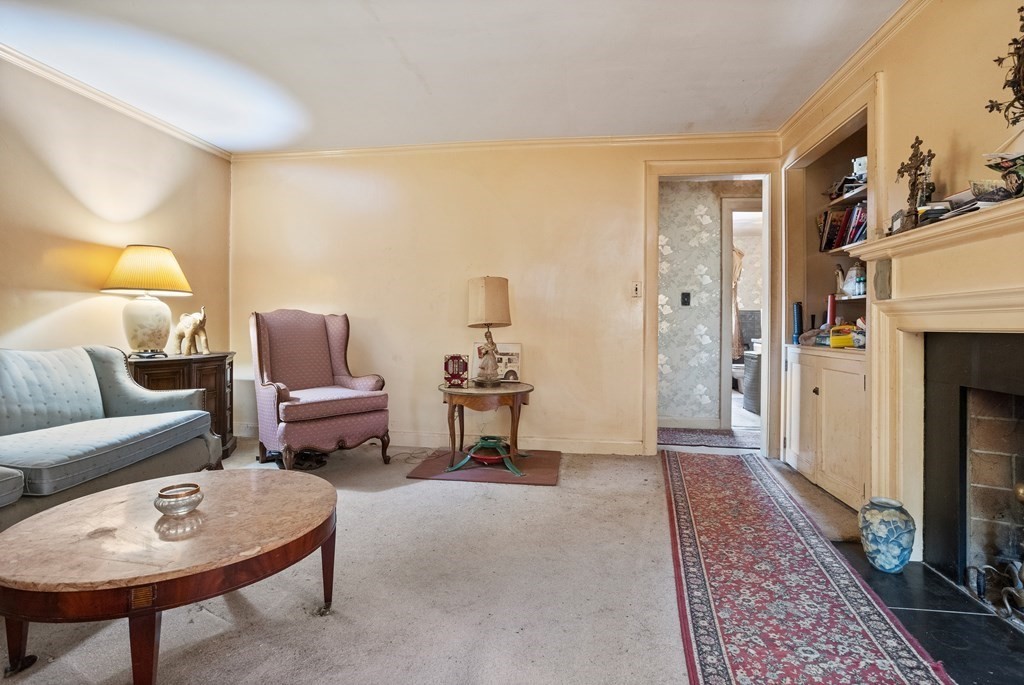 265 Varick Road Newton, MA 02468 - Photo 7 of 22 a living room with furniture and a fireplace