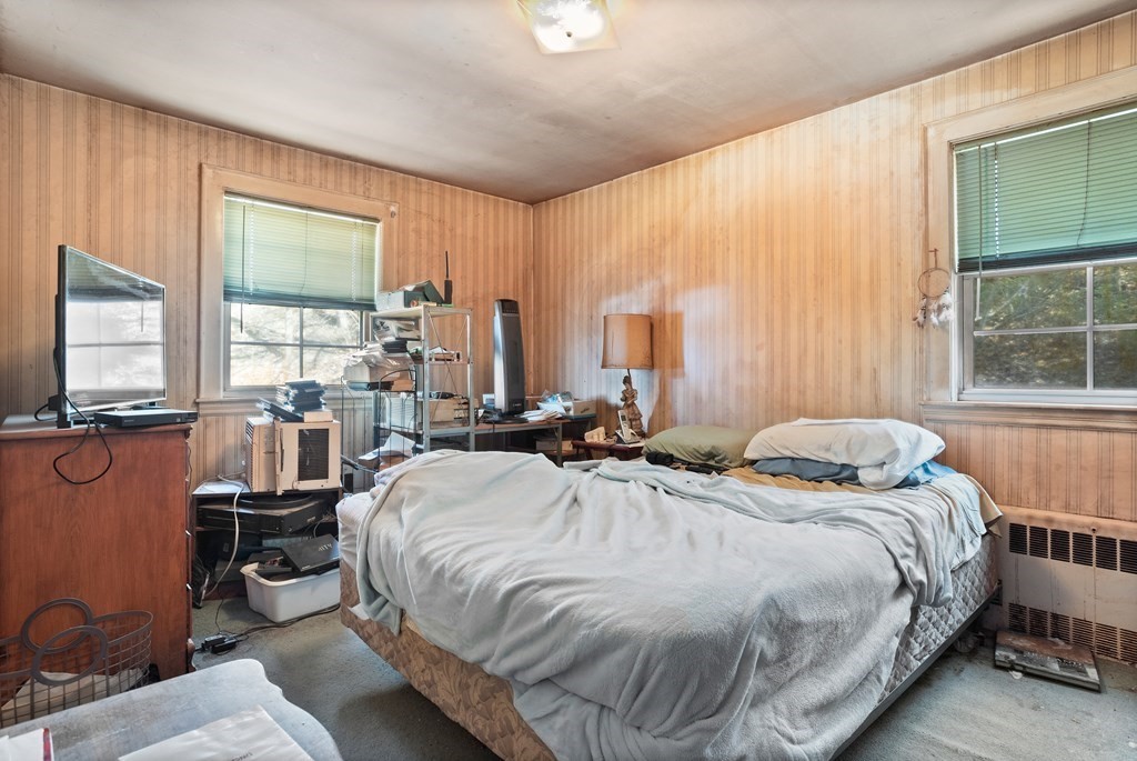265 Varick Road Newton, MA 02468 - Photo 10 of 22 a bedroom with a bed and large windows