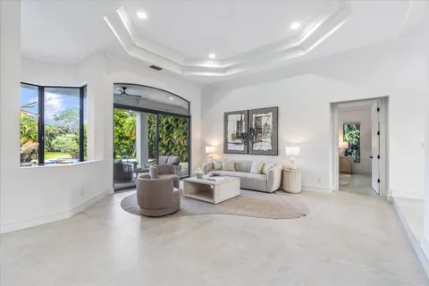 a living room with furniture and windows