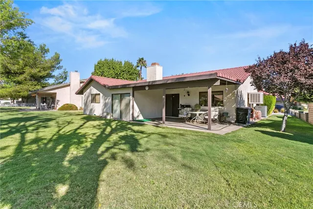 a view of a basketball area with green space