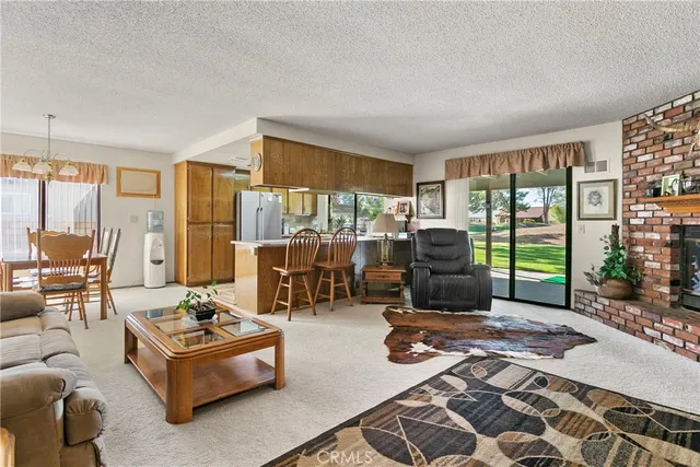 a living room with furniture wooden floor and a table