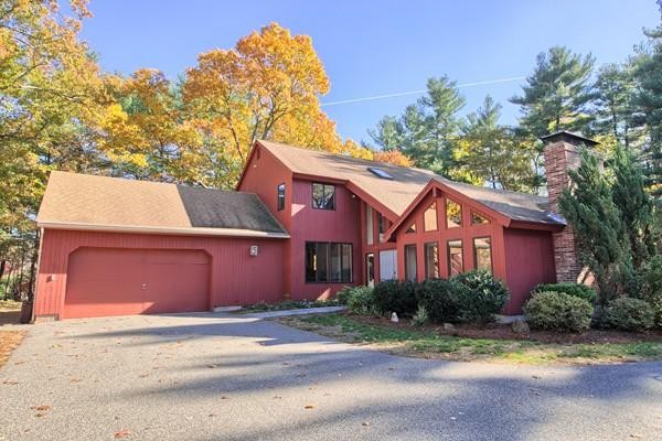 75 Mill Road Chelmsford, MA 01824 - Photo 1 of 17 a front view of a house with a yard and garage