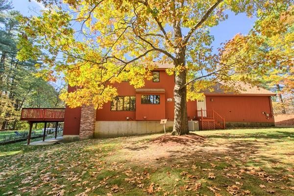 75 Mill Road Chelmsford, MA 01824 - Photo 16 of 17 a house with trees in front of it