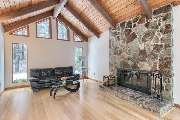 75 Mill Road Chelmsford, MA 01824 - Photo 4 of 17 a living room with furniture and a fireplace